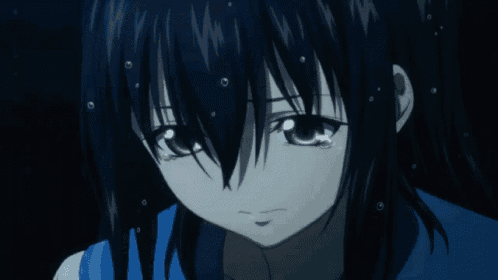 a girl in a blue skirt is kneeling down