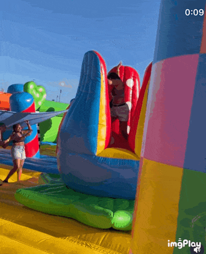 a video of a bouncy house with the time of 9:09
