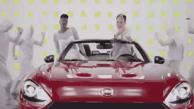 a red car with the word fiat on the front of it
