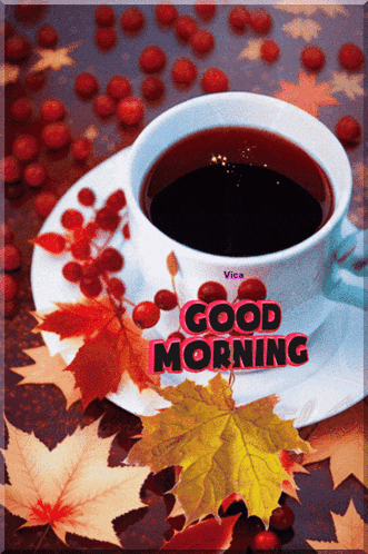 a cup of coffee sits on a saucer with the words good morning written on it