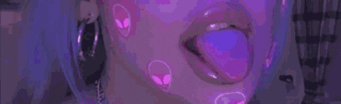 a close up of a woman 's mouth with a purple tongue sticking out and the word ios written on the bottom
