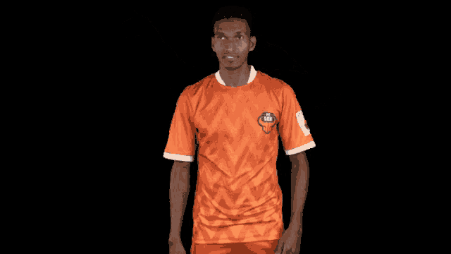 a man wearing an orange shirt that says ' chennai super kings ' on the front