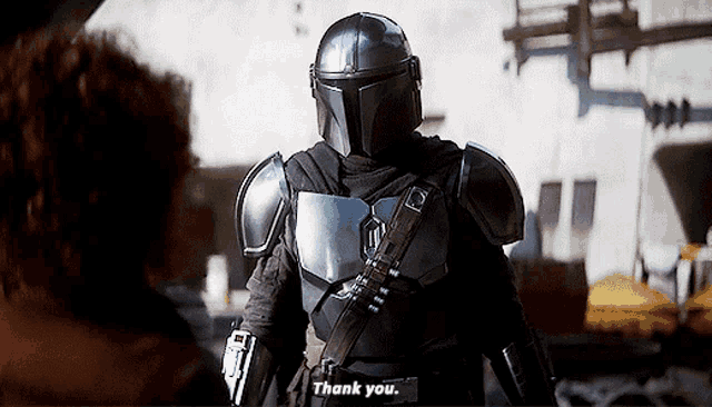 a man in armor is saying thank you to another man