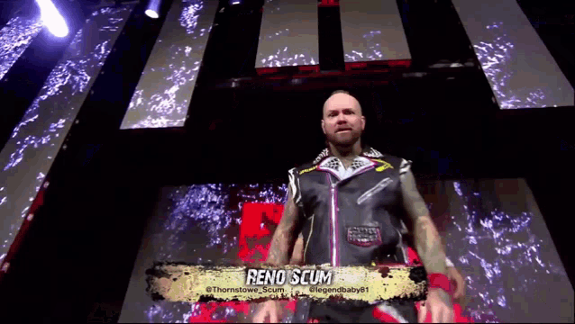 a wrestler named reno scum is standing in a dark room