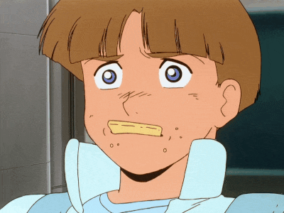 a close up of a cartoon character 's face with a yellow item in his mouth
