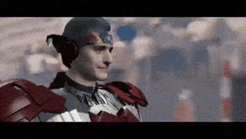 a man in a captain america costume is smiling in a blurry photo
