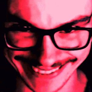 a close up of a person wearing glasses and a red background