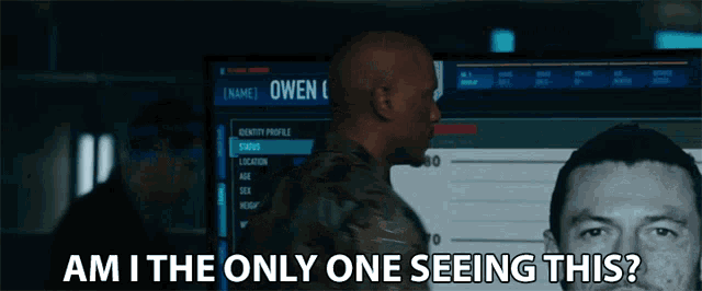 a man standing in front of a screen that says owen on it