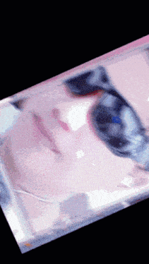 a close up of a person 's face with sunglasses on it
