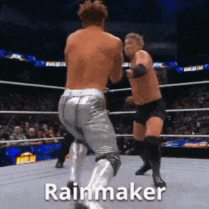 two men are wrestling in a ring and the word rainmaker is on the bottom right