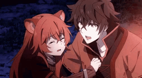 a boy and a girl are standing next to each other in a dark room