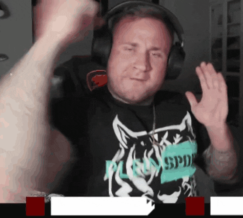a man wearing headphones and a black shirt that says spd on it