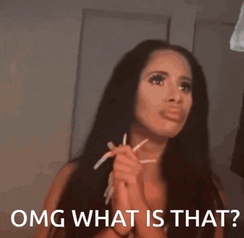 a woman with long hair is holding a pair of pencils in her hands and says omg what is that