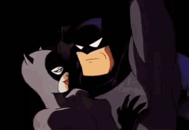 batman and catwoman kissing in a cartoon scene