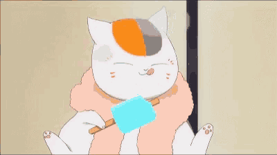 a cartoon cat is eating a blue popsicle with a stick .