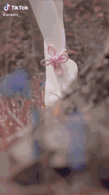 a woman in a costume is holding a cane with a tiktok watermark on the bottom right
