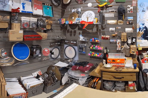 a display of musical instruments including a drum set that says ' all-in-one drum set ' on it