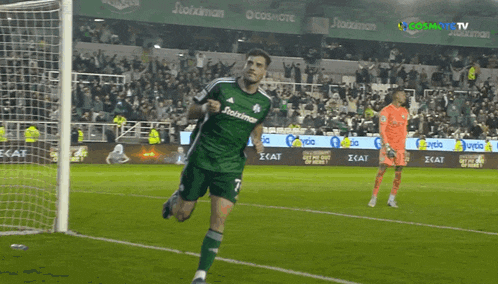 a soccer player wearing a green shirt that says stoixman