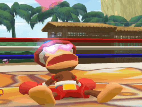 a monkey wearing boxing gloves is laying on the ground in a boxing ring