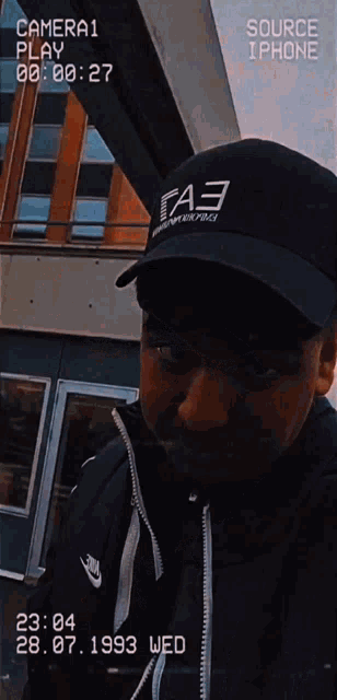 a man wearing a black hat that says fa3