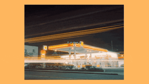 a picture of a gas station that says tones on the front