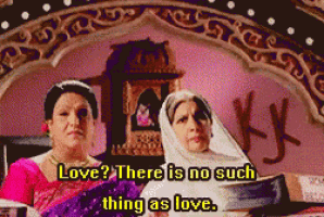 two women are sitting on a bed with the words love there is no such thing as love written above them
