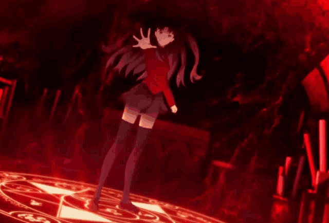 a girl is standing in a dark room with a red light surrounding her