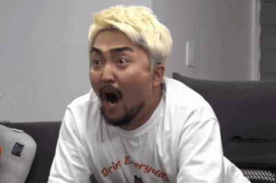 a man with blonde hair and a beard is wearing a white shirt that says drift everyday