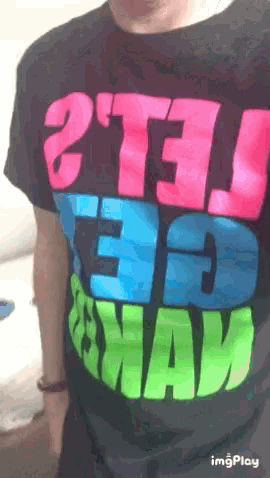 a person wearing a t-shirt that says " 2t13 " on it