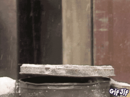 a gif of a manhole cover with the words gif jif on the bottom