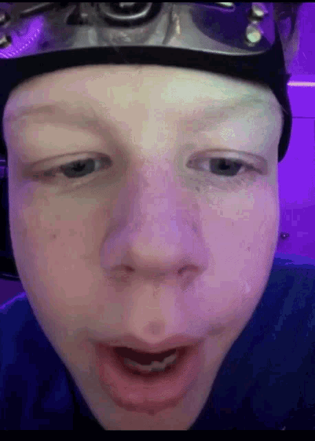 a close up of a person 's face wearing a goggles
