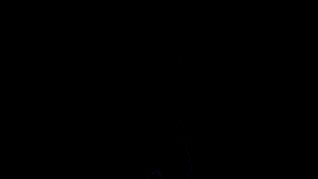a man wearing a white alienware shirt stands in front of a black background