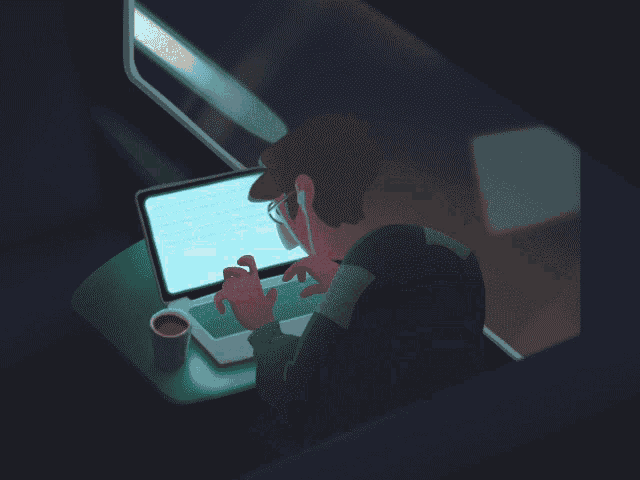 a man is typing on a laptop with a cup of coffee on the table