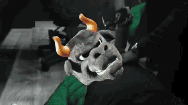 a stuffed animal with horns and a smile on its face