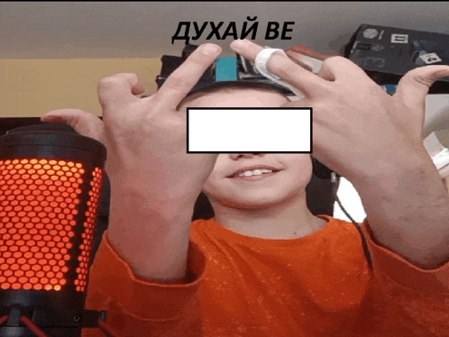 a person giving the middle finger in front of a red microphone with the word " duhai be " on the bottom