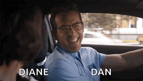 a man is sitting in a car with the words diane and dan above him .