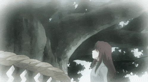 a girl looking up at a tree with a rope hanging from it