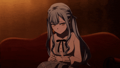 two anime girls are sitting next to each other