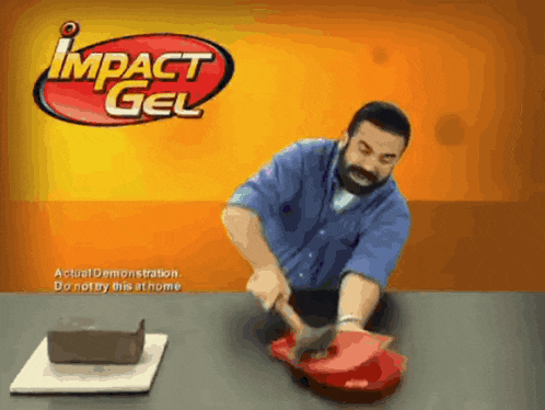 an advertisement for impact gel shows a man using a hammer on a red object