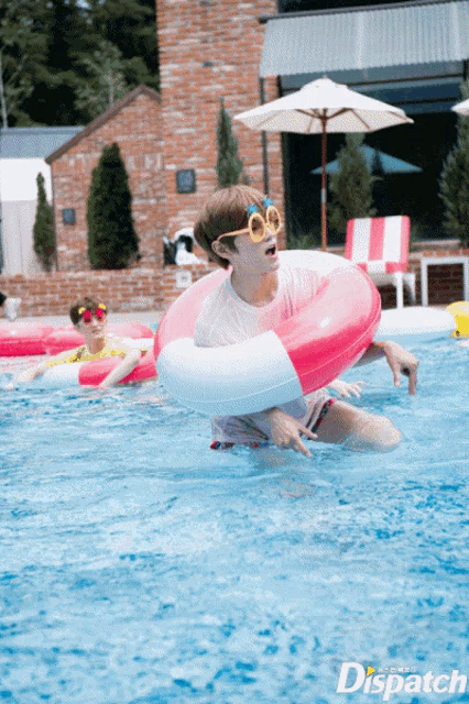 a person in a swimming pool with a dispatch logo