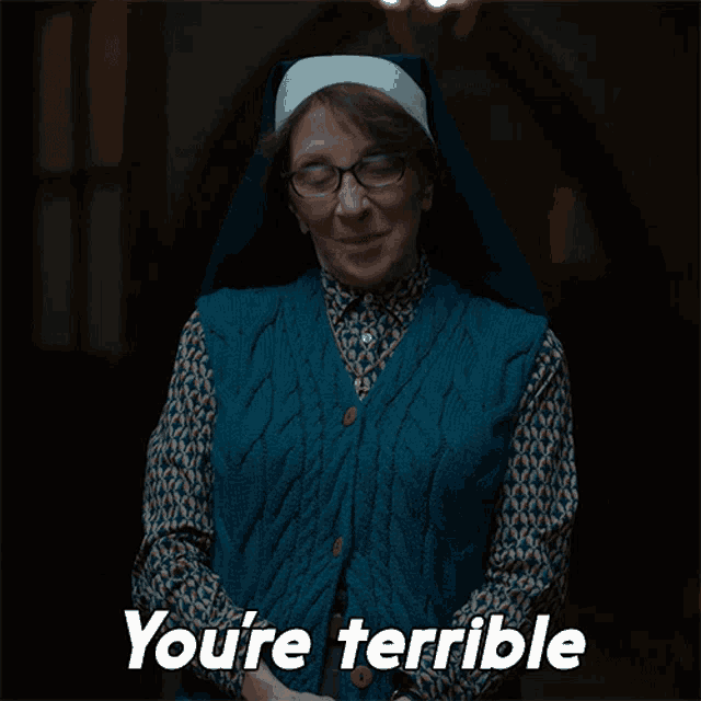 a nun says you 're terrible while wearing glasses and a blue vest