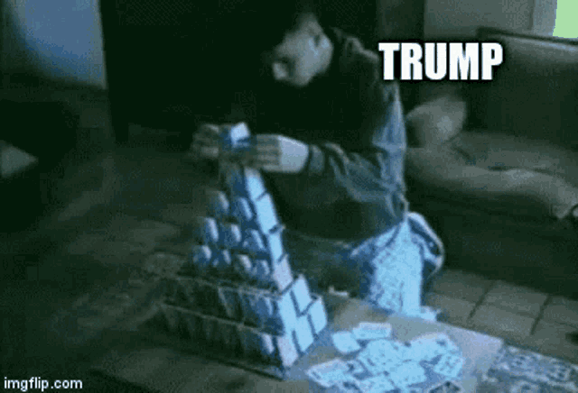 a man sitting on a couch playing a game of cards with the words trump #covid19 written above him