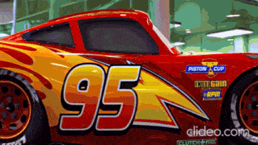 a red and yellow race car with the number 95 on it