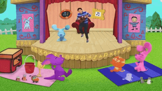 a cartoon scene with a man playing a guitar