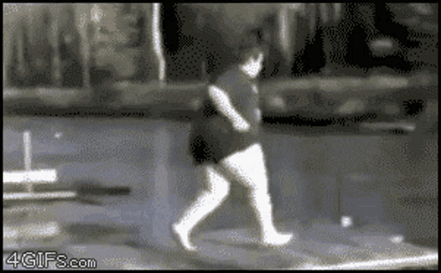 a pixelated image of a person walking with the website 4gifs.com at the bottom right