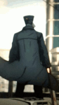 a blurry picture of a man in a uniform with a hat on