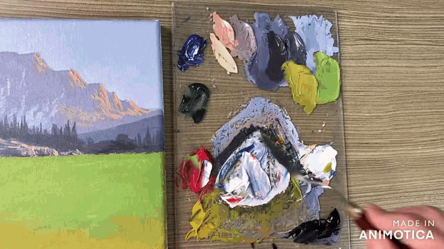 a painting is being painted on a canvas with the words made in animatica above it