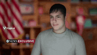 a man is standing in front of a cnn news exclusive