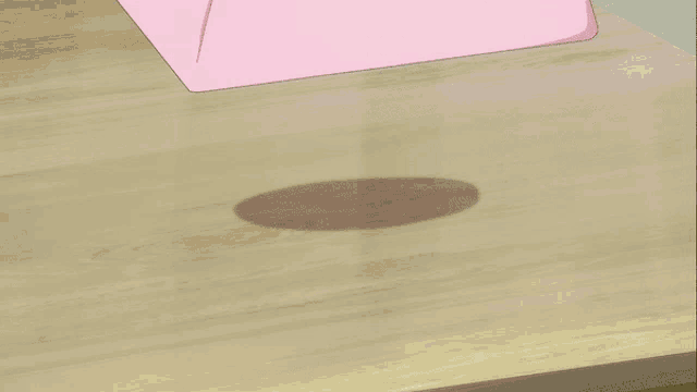 a large piece of gold is wrapped in a pink cloth