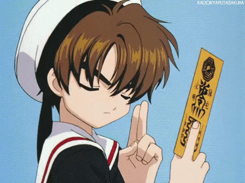 a boy in a sailor hat is holding a piece of paper with chinese writing